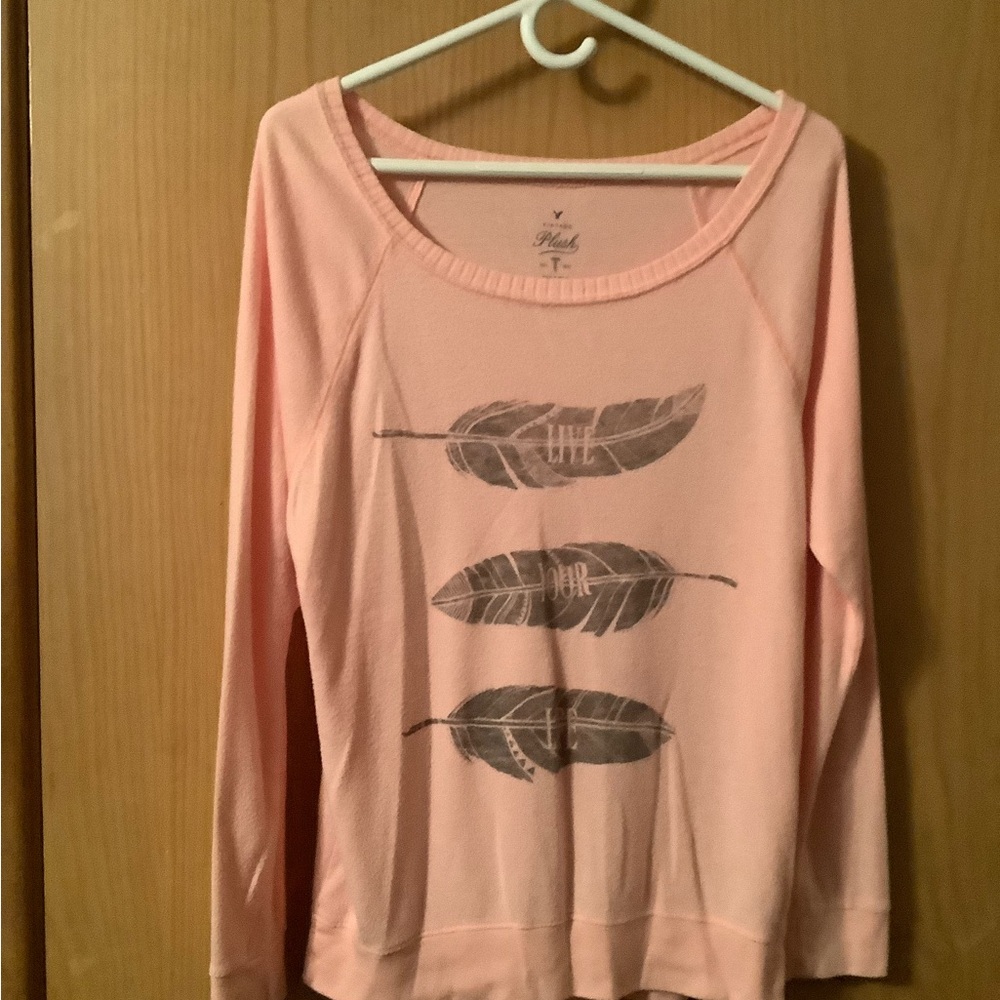 Womens lightweight & long sleeved top by Plush. Size large